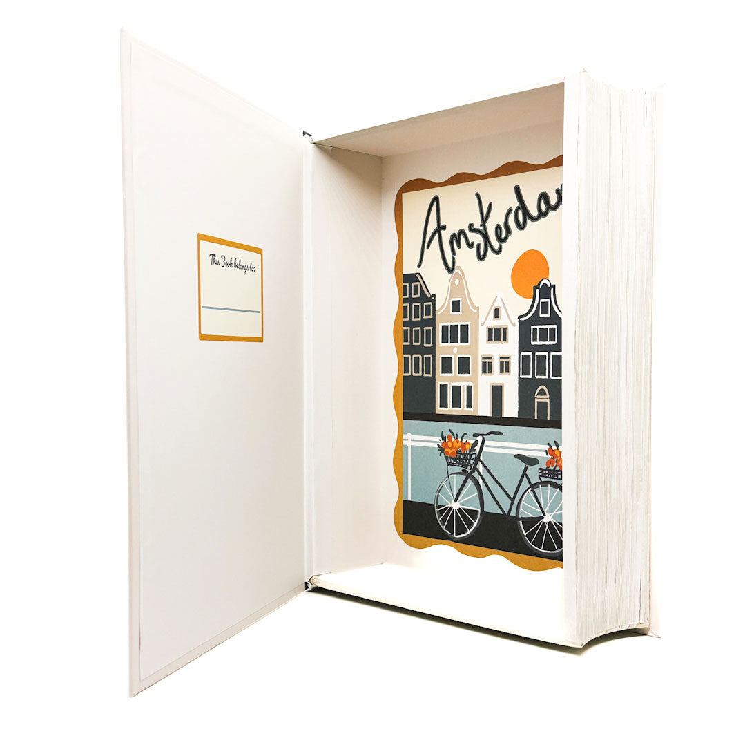 Open book with a illustration of Amsterdam on the cover