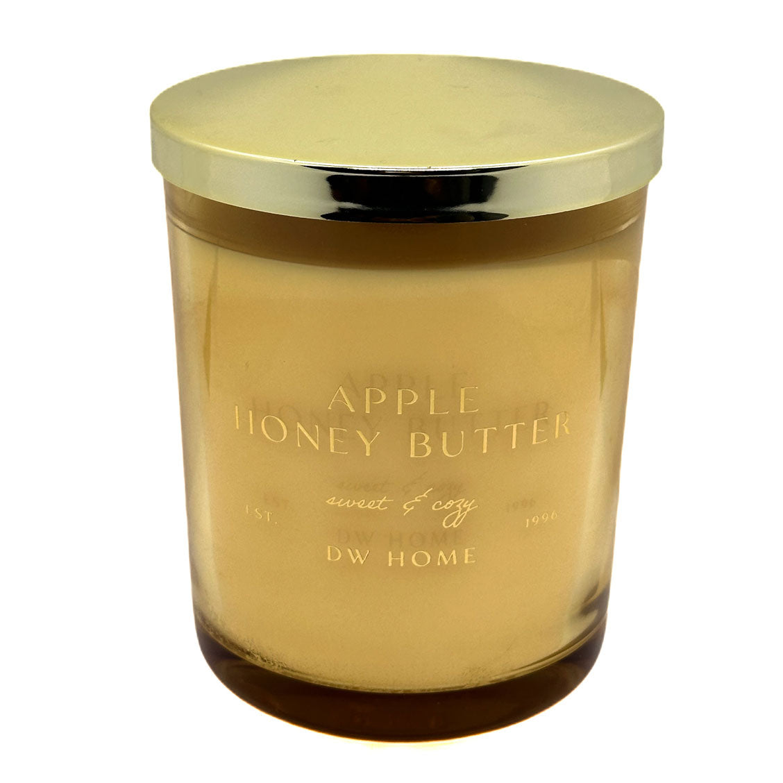 Glass candle with gold lid labeled 'Apple Honey Butter' by DW Home on a white background