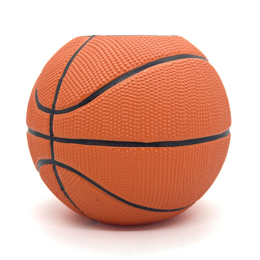 Orange basketball shaped pen and pencil holder with black lines on a white background