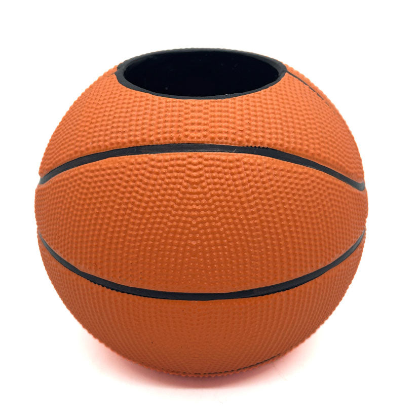 Basketball-shaped pen holder on a white background