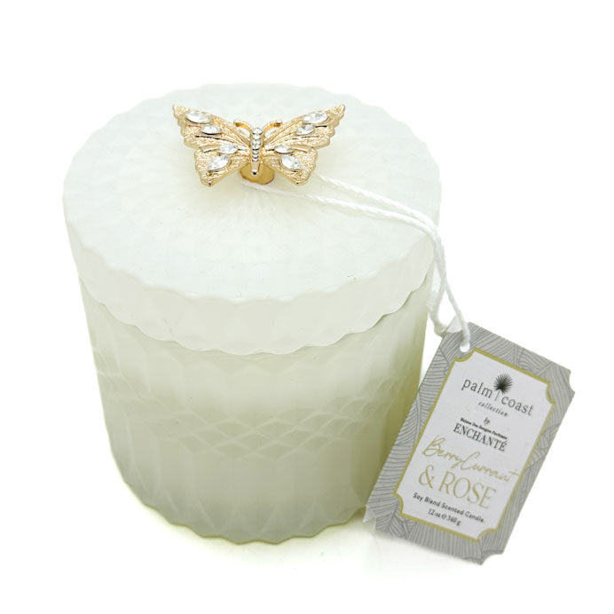 Berry Currant & Rose white candle with a gold butterfly decorative element and a label on a white background