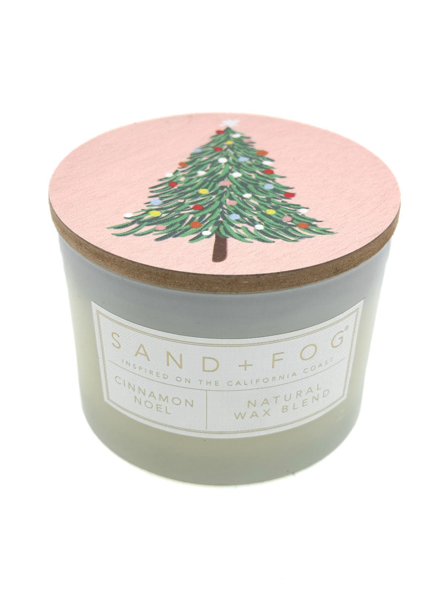 Cinnamon Noel Candle - SAND + FOG with a Christmas tree on the lid.
