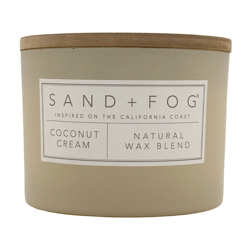 Coconut Cream Candle with 'Sand + Fog' label on a white background