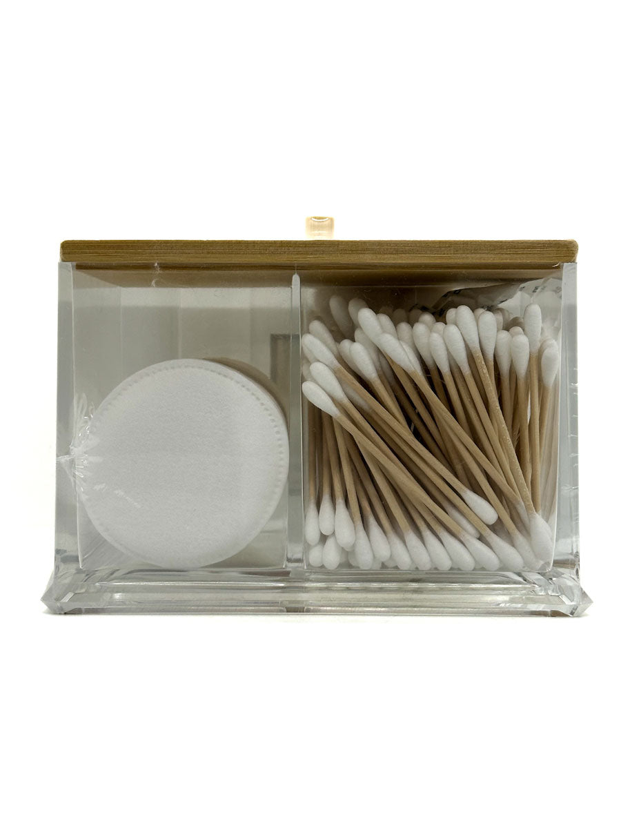 Clear container with wooden lid holding cotton pads, cotton swabs, and Q-tips on a white background