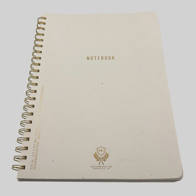 Design Works beige notebook with gold spiral binding and branding on a white background