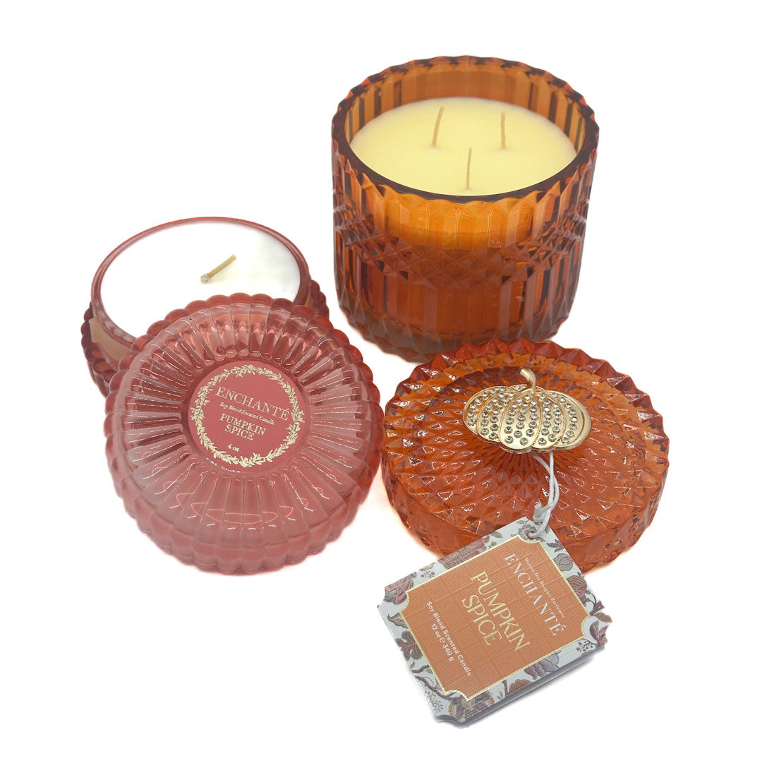 Enchante decorative candles with textured glass and a pumpkin spice label on a white background