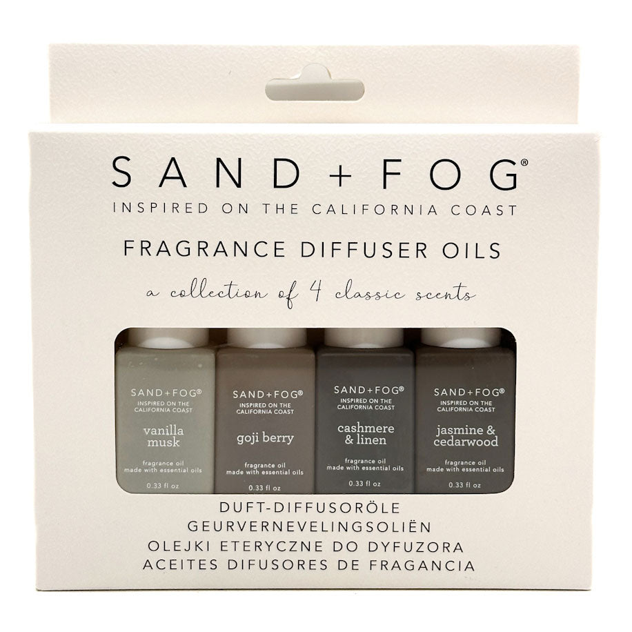 Sand + Fog fragrance diffuser oils packaging with four bottles inside.