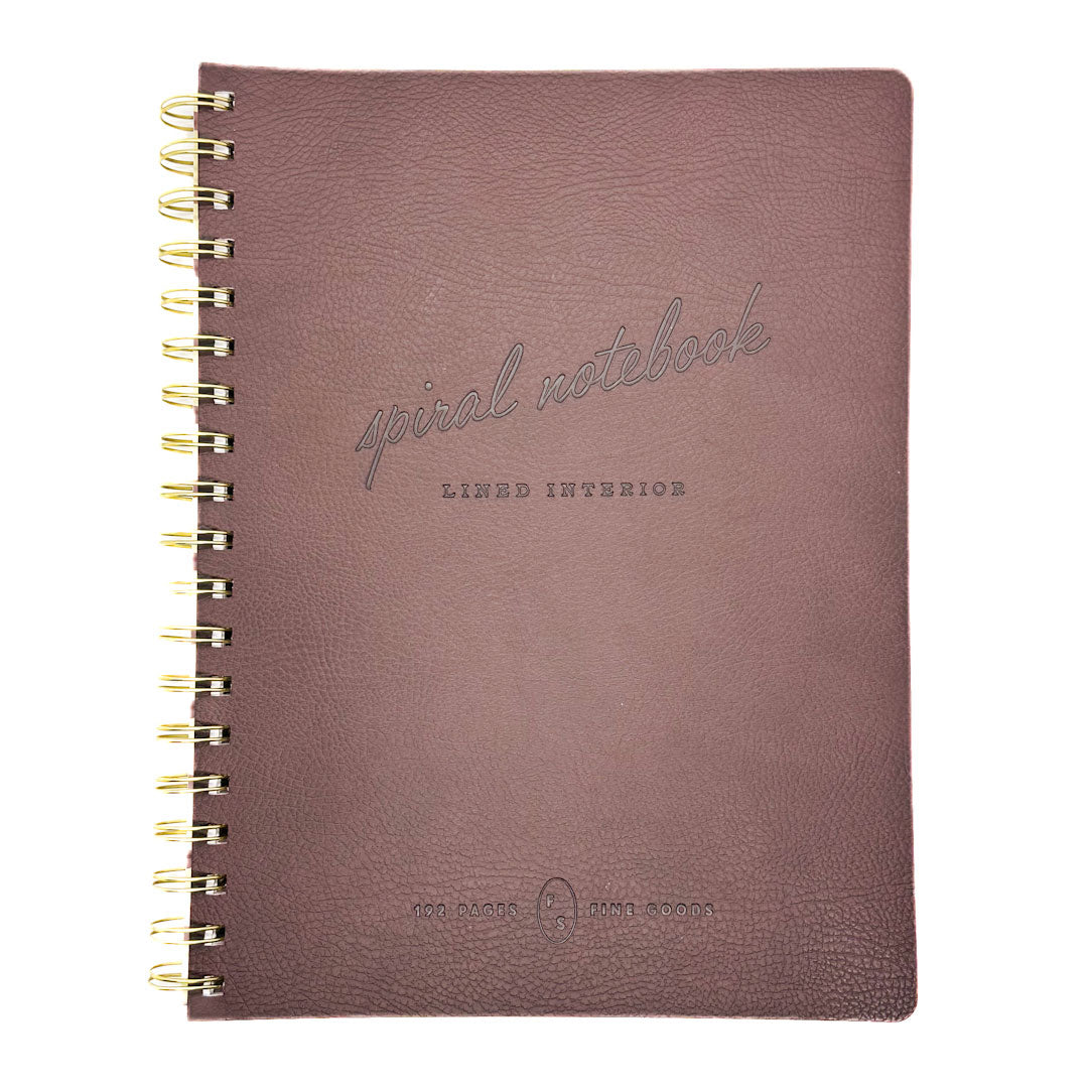 Fringe studio brown spiral notebook with gold spiral binding on a white background