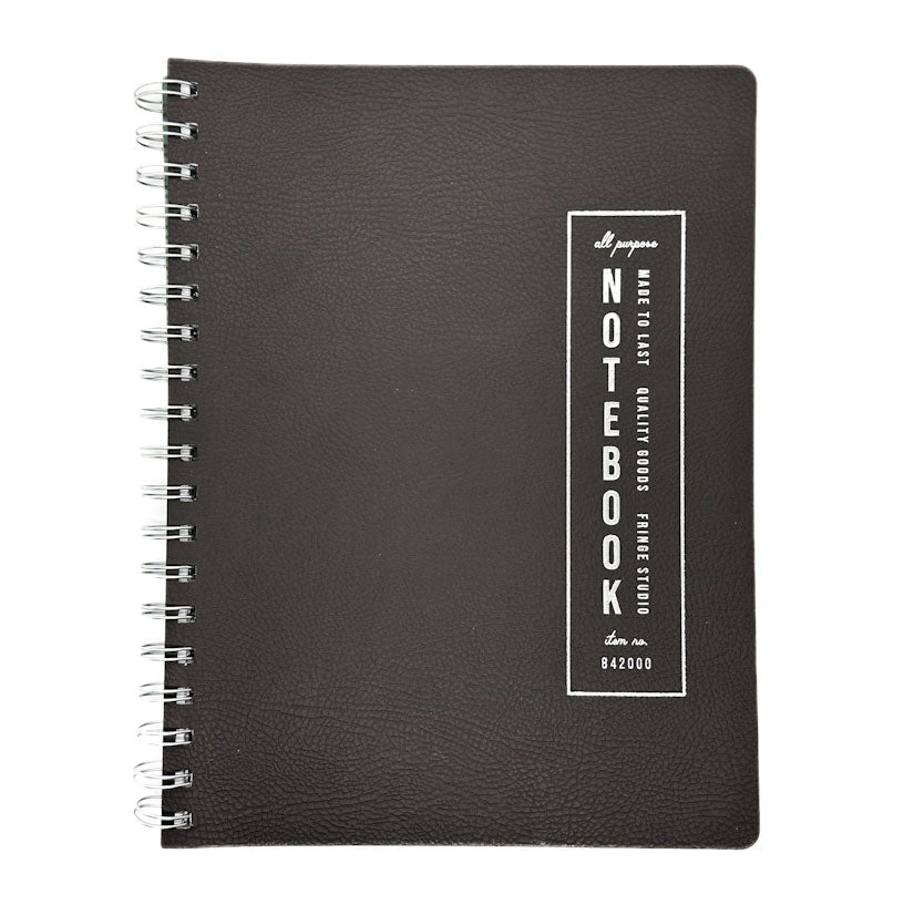 Fringe Studio black soft leather notebook with a white label on a white background