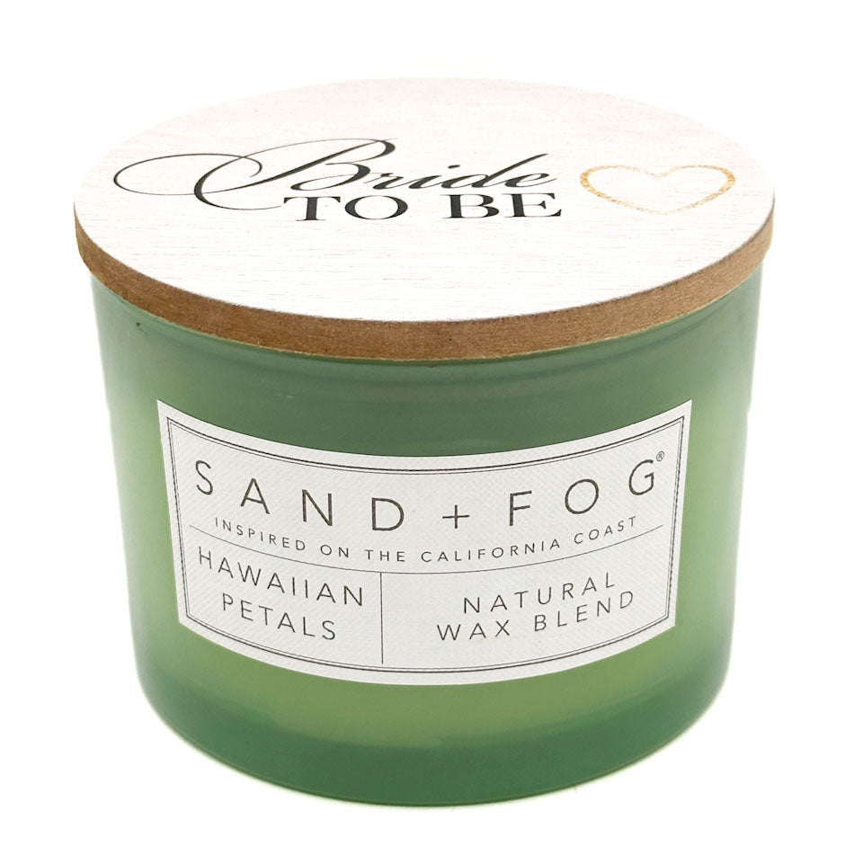 Green candle with 'Bride To Be' lid and Sand + Fog label on a white background
