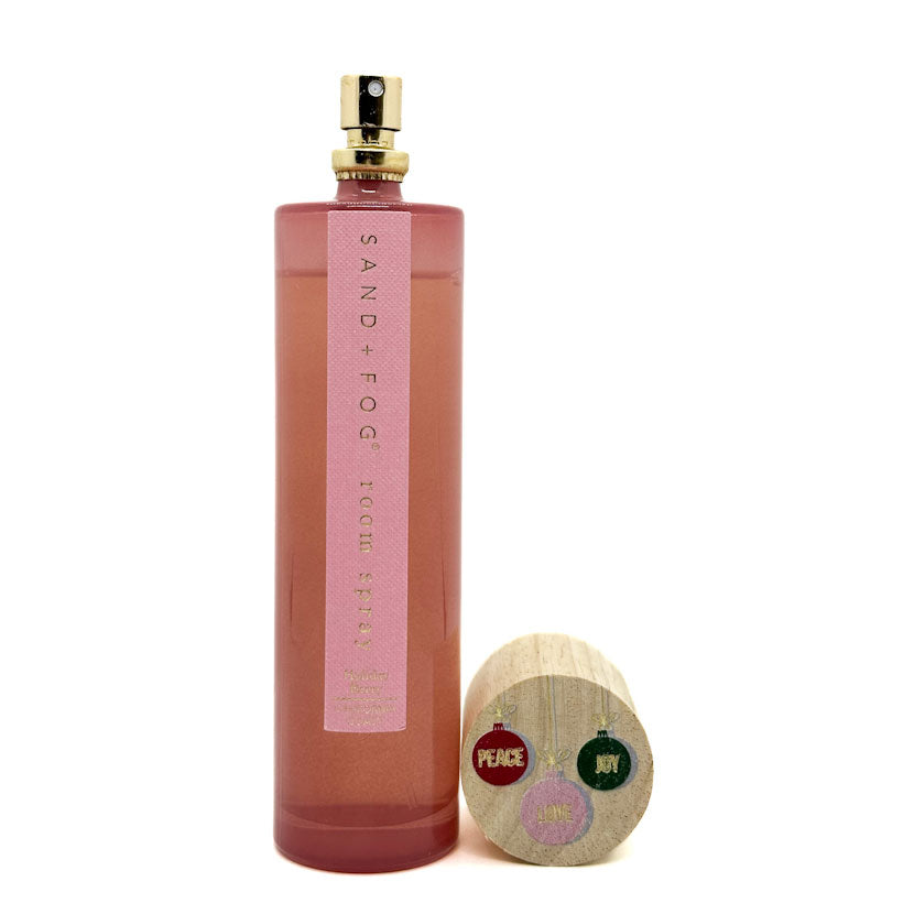SAND + FOG room spray bottle with a wooden cap.