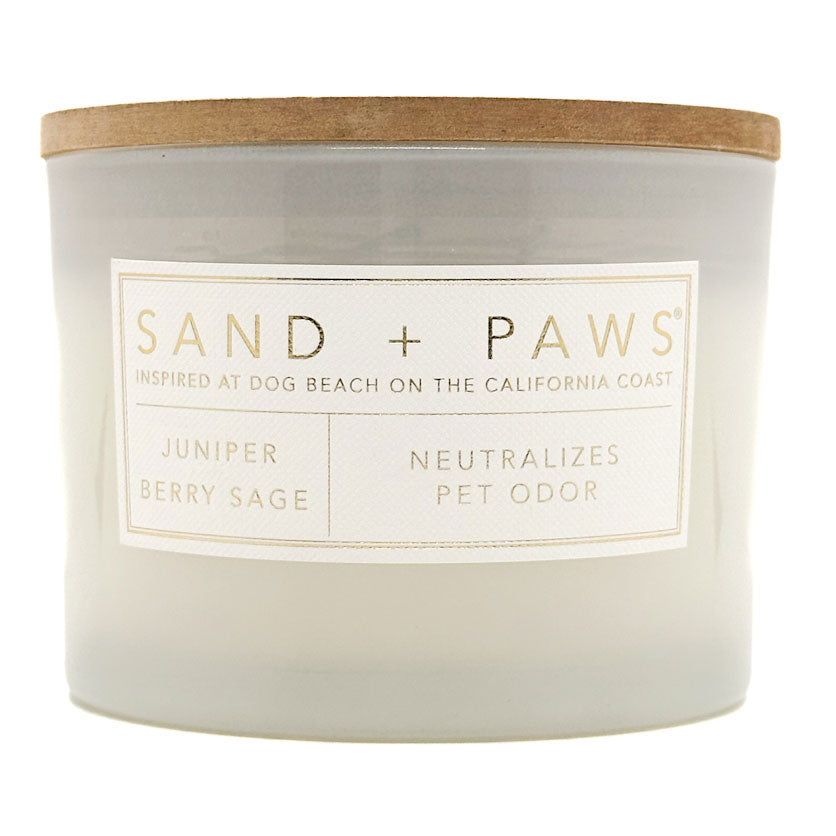 Juniper Berry Sage Candle with 'Sand + Paws' label on a white background