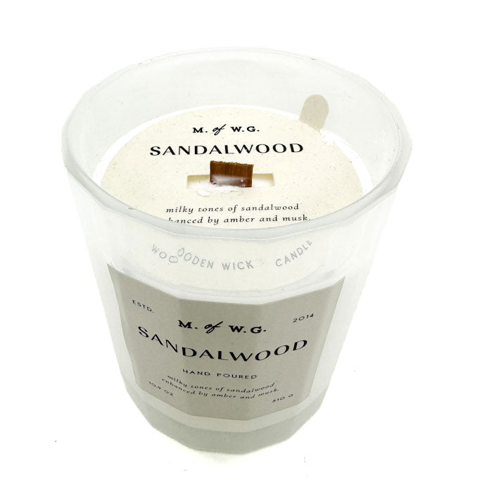 MWG Sandalwood candle in a clear container with a white label on a white background