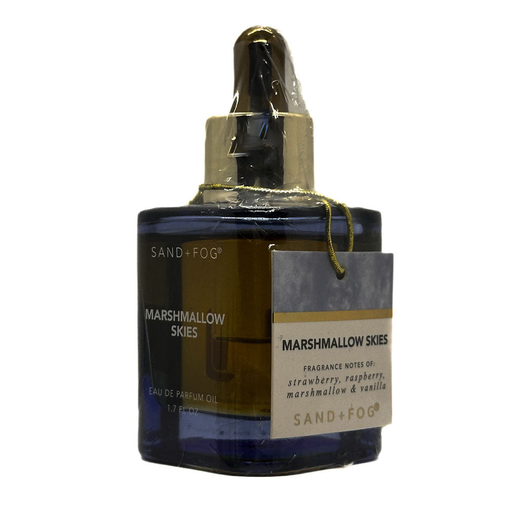 Perfume oil bottle labeled 'Marshmallow Skies' by Sand + Fog on a white background