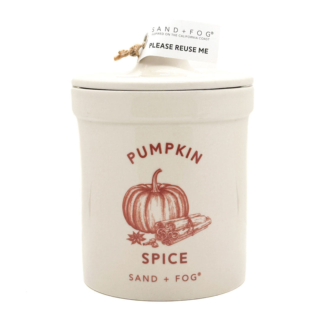 SAND + FOG Pumpkin spice candle in a ceramic container with lid on a white background