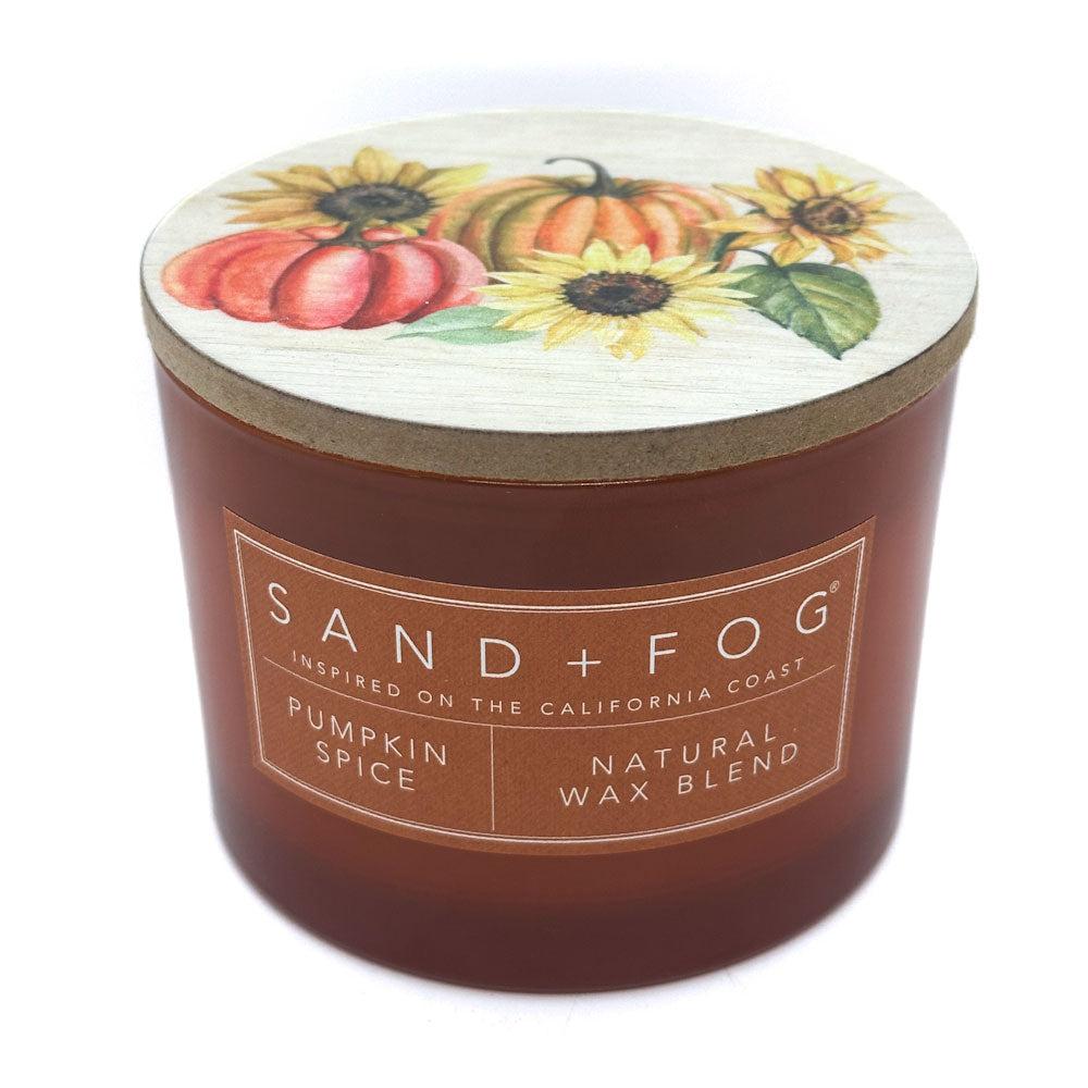 Pumpkin Spice Candle with a decorative lid featuring pumpkins and sunflowers, branded as Sand + Fog.