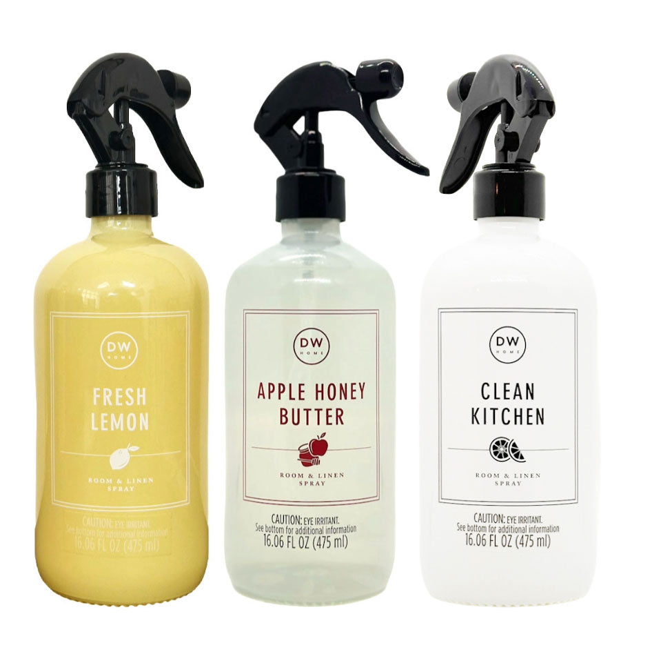 DW Home Room & Linen spray bottles with different scents on a white background