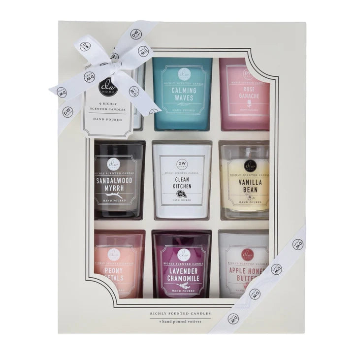 Set of candles in a decorative box with labels on a white background