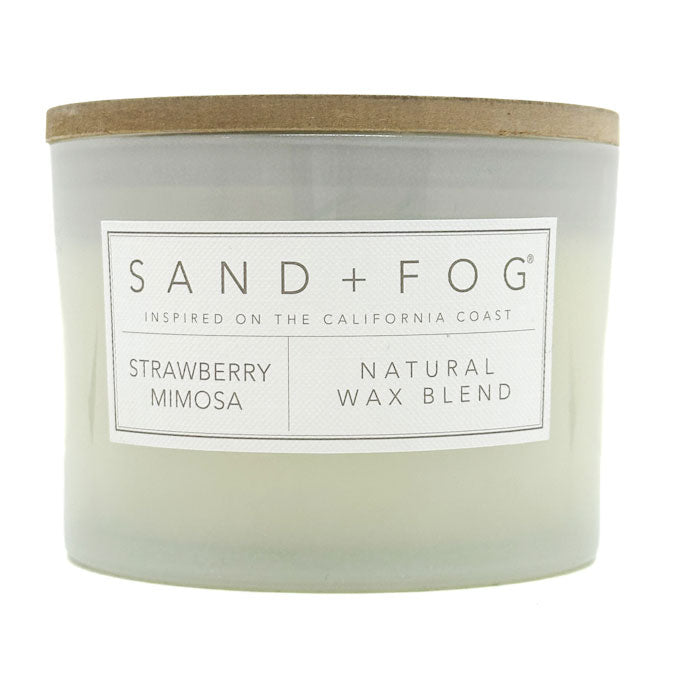 Strawberry Mimosa Candle with 'Sand + Fog' label on a white background