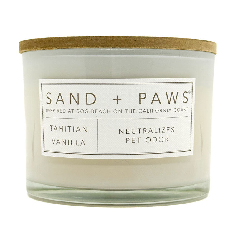 Tahitian Vanilla Candle with 'Sand + Paws' label on a white background