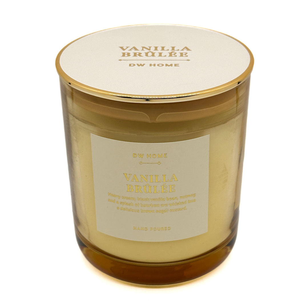 Vanilla Brûlée candle with a gold lid on a white background