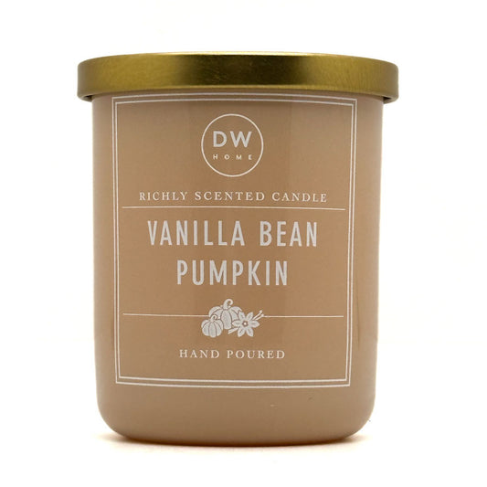 A DW Home Vanilla Bean Pumpkin scented candle in a matte taupe jar with a metallic gold lid, shown on a clean white background.
