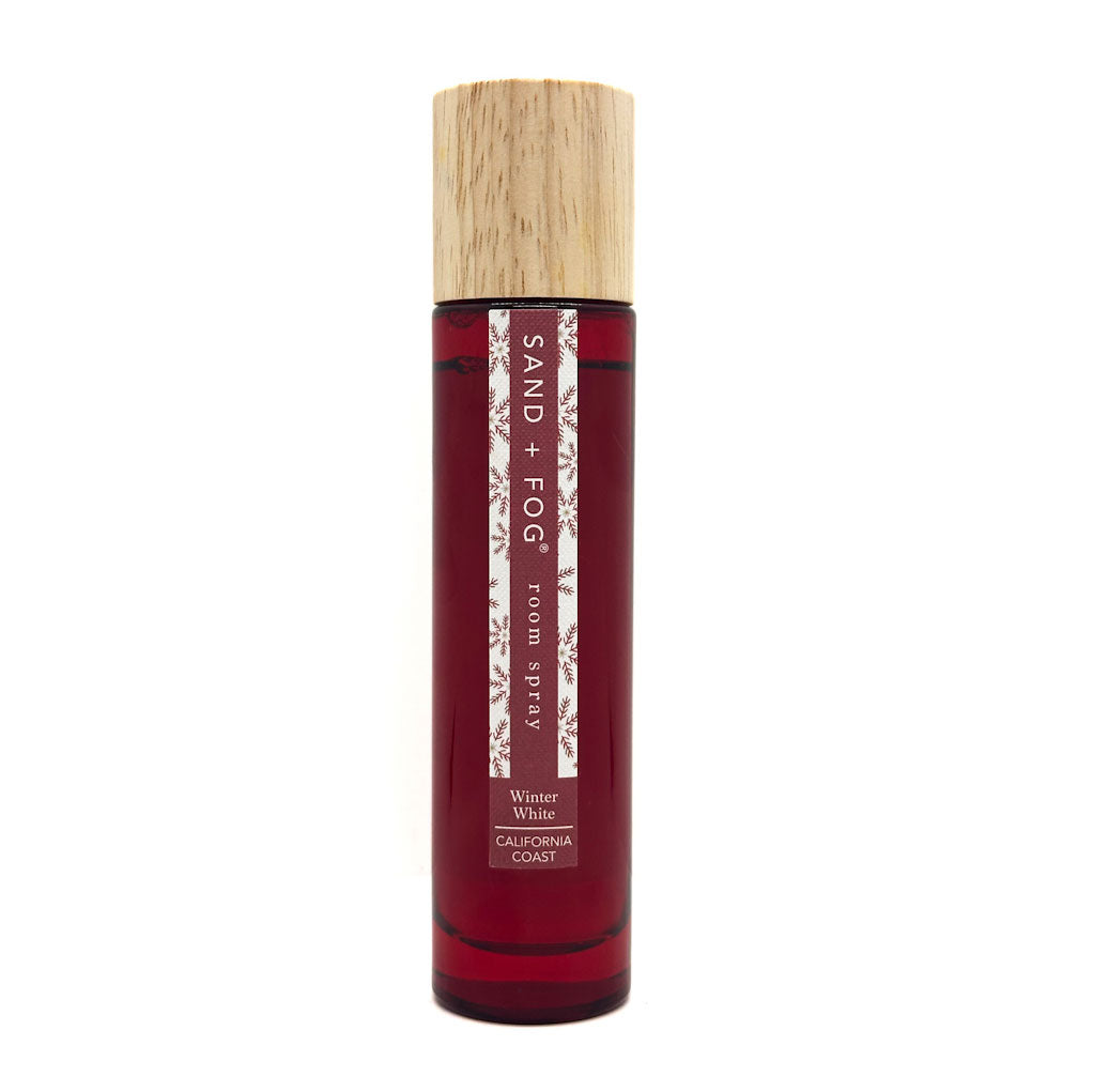 SAND + FOG Winter White red room spray bottle with wooden cap on a white background