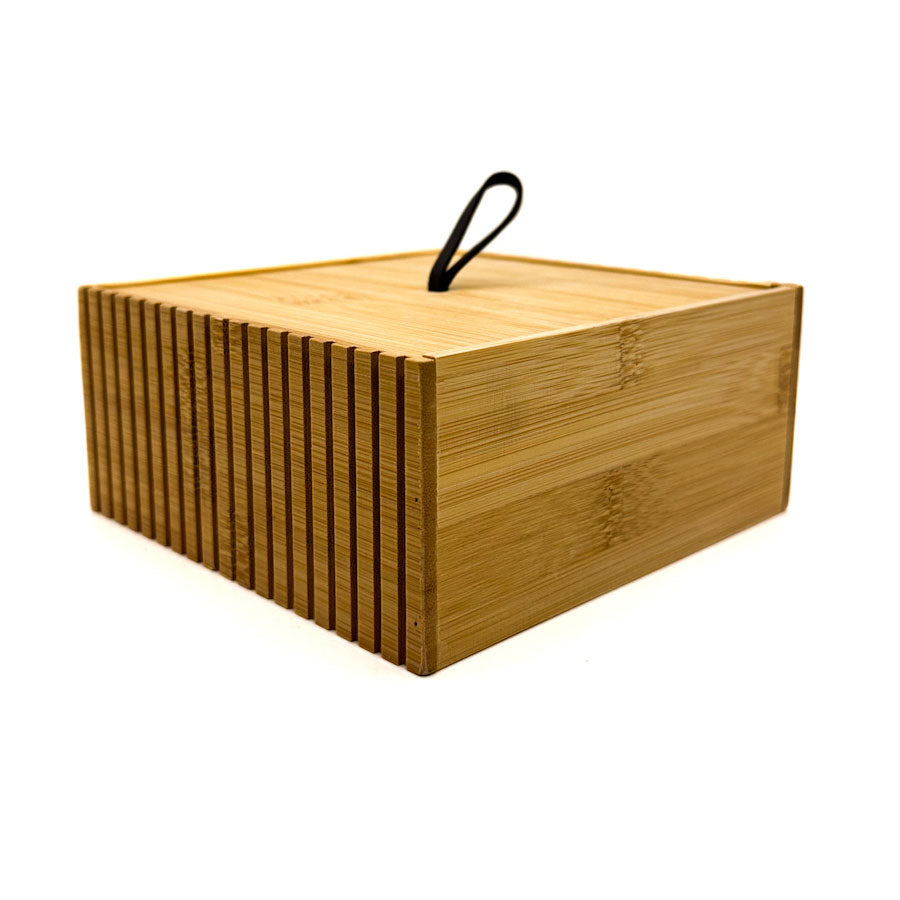 Bamboo storage box with a handle on a white background