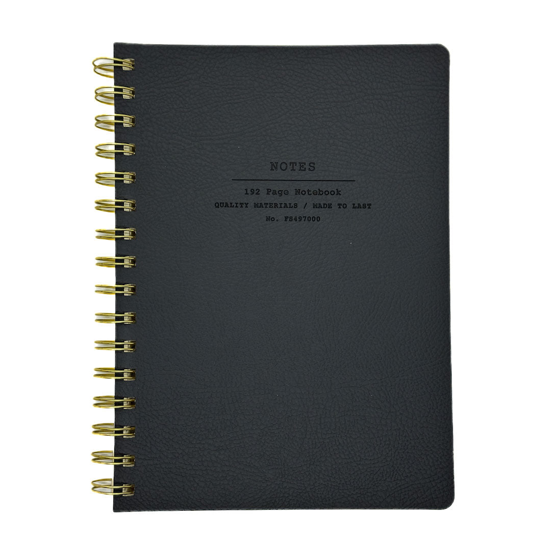 Fringe Studio Black notebook with gold spiral binding on a white background