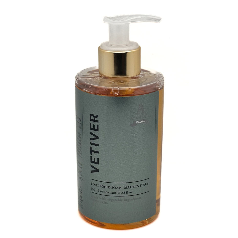 A bottle of Vetiver Fine Liquid Soap by Alchimia featuring a grey label, amber-coloured liquid, a gold pump collar, and a clear plastic pump dispenser, set against a plain white background.