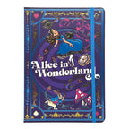 A hardcover journal featuring an illustrated cover design from Alice in Wonderland, with Alice floating, the White Rabbit, a red mushroom, and ornate gold decorative borders on a purple background. A blue elastic closure band is visible on the right side.