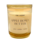 DW Home Apple Honey Butter candle in a clear glass jar with a gold lid on a white background