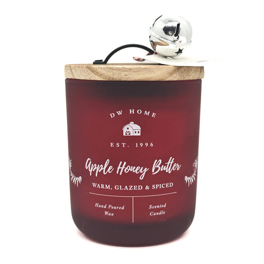 Apple Honey Butter Red candle with wooden lid and silver bell, featuring DW Home branding.