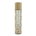 Apple Spice Room spray bottle with floral design and wooden cap on a white background