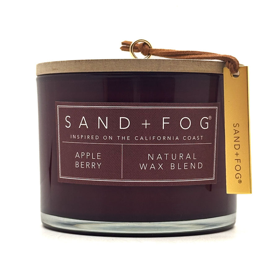 Sand + Fog Apple Berry candle with a label on a white background