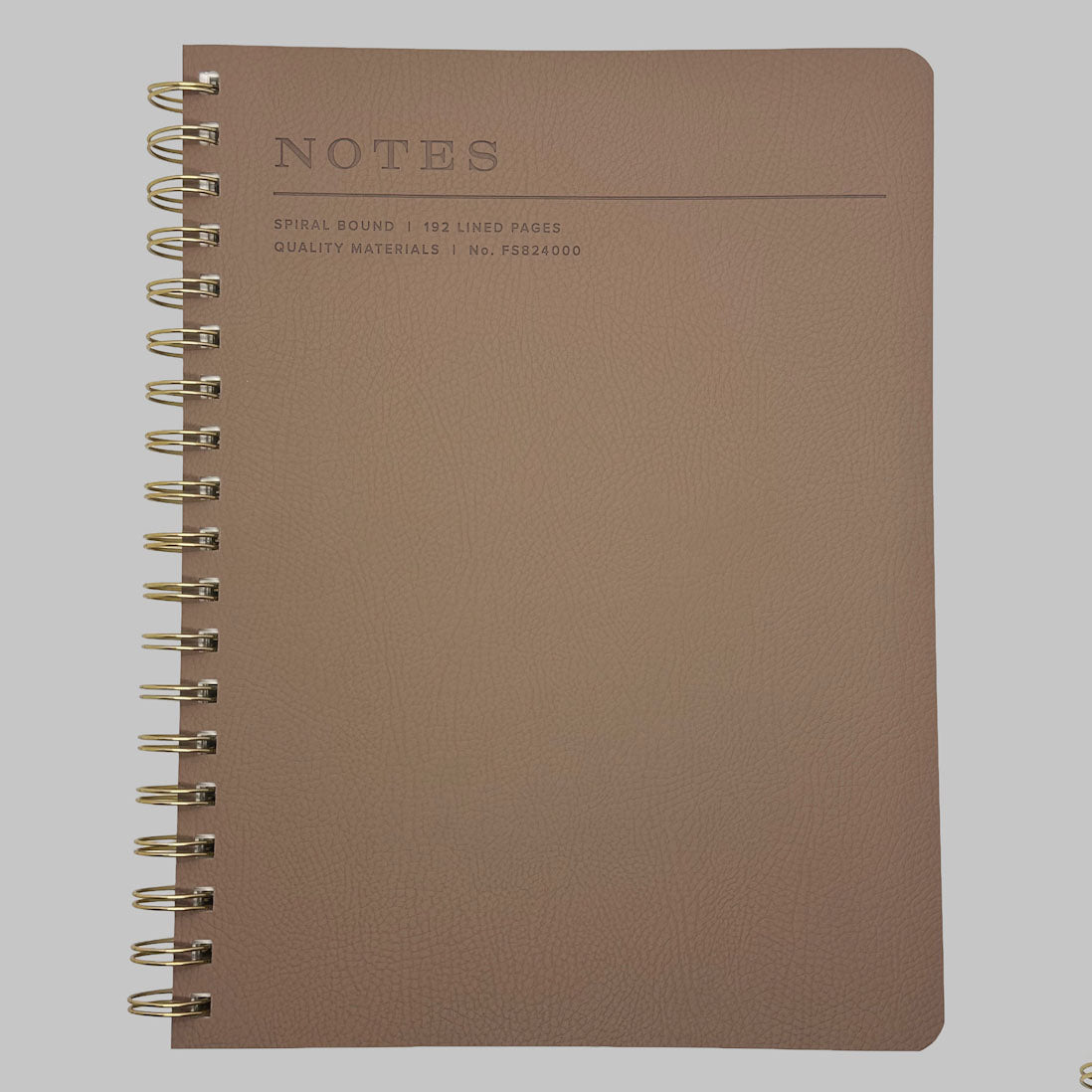 Fringe Studio brown notebook with spiral binding on a grey background