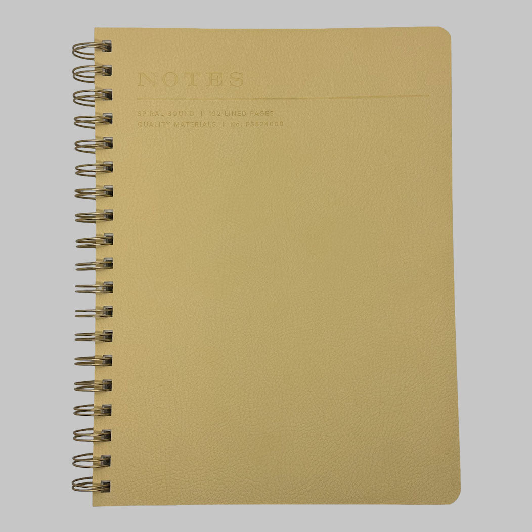 Fringe Studio yellow notebook with spiral binding on a grey background
