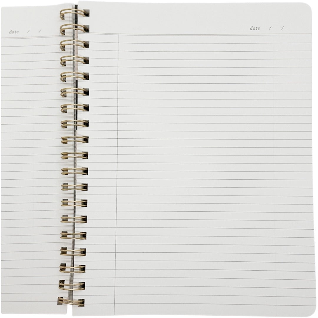 An open spiral-bound lined notebook with white pages and a metallic spiral binding, photographed against a plain white background.