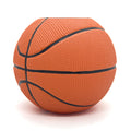 Orange basketball shaped pen and pencil holder with black lines on a white background