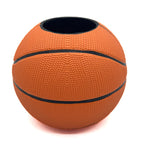 Basketball-shaped pen holder on a white background