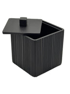 Black ribbed container with a lid on a white background