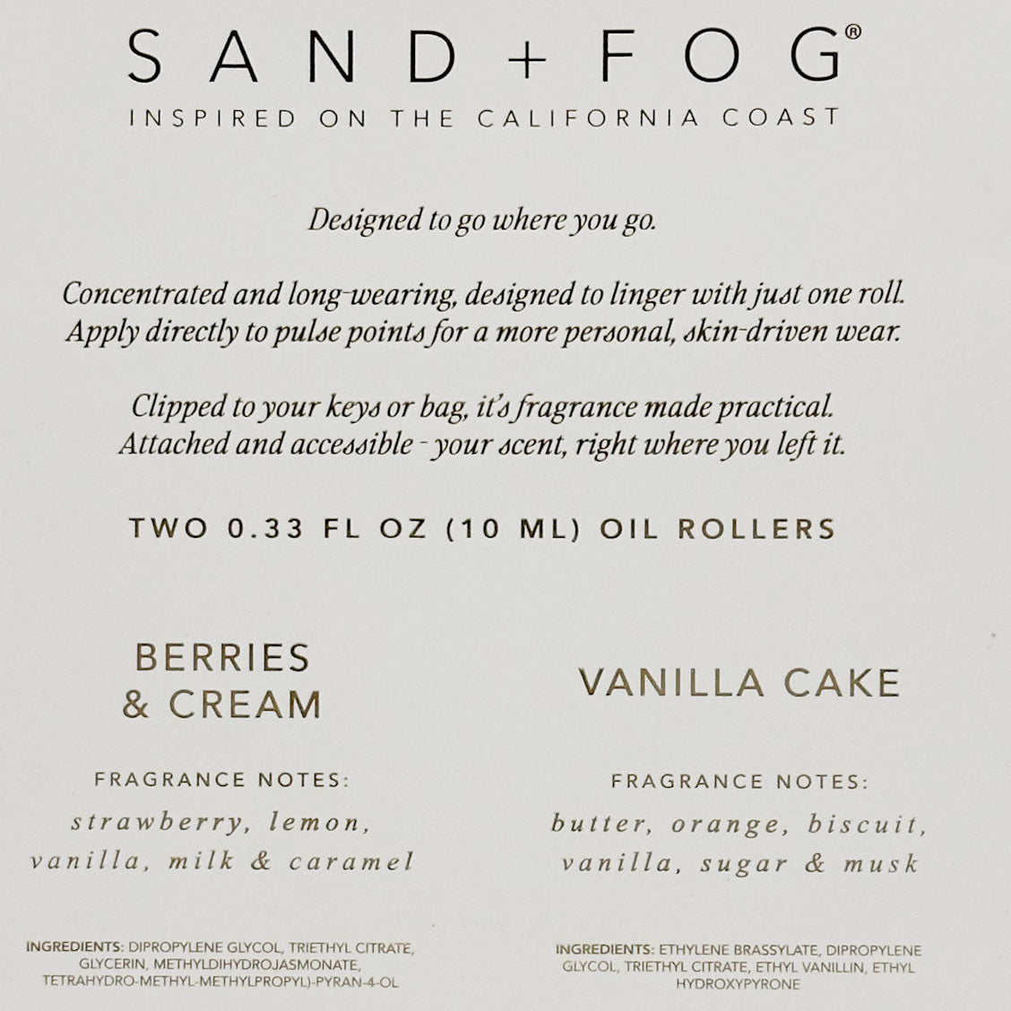 Front packaging panel for Sand + Fog oil rollers, showing product text on a light warm gray background. The top reads SAND + FOG with the California Coast mark, followed by descriptive copy.