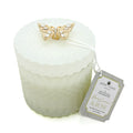 Berry Currant & Rose white candle with a gold butterfly decorative element and a label on a white background
