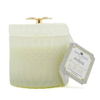 Berry Currant White candle by Enchante with a gold lid and 'Palm Coast' label on a white background