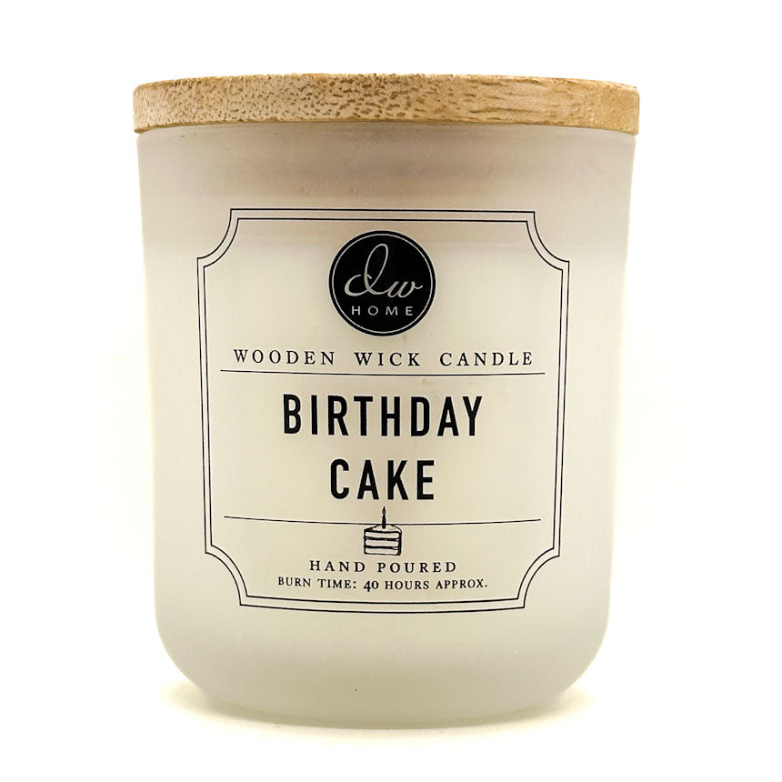 DW Home candle with 'Birthday Cake' label and wooden wick on a white background
