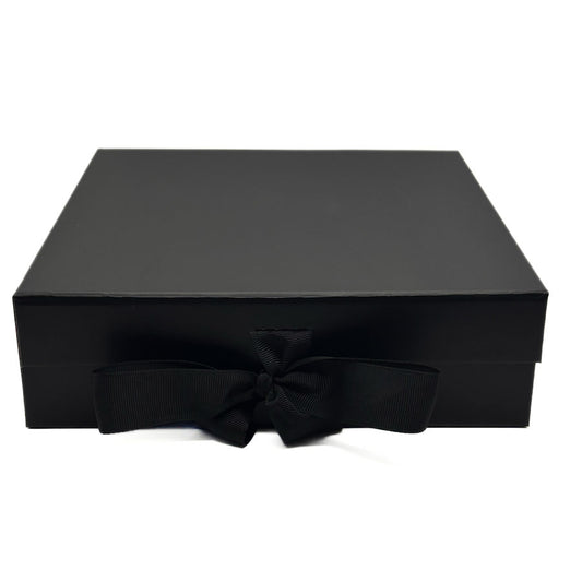 Black gift box with a bow on a white background