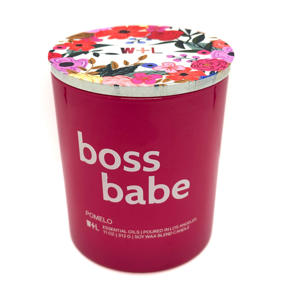 W+L Pomelo pink candle with 'boss babe' text and flowers on lid on a white background