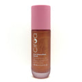 A bottle of Ciroa Marshmallow Musk Shimmer Body Oil, featuring a pink cap and a brown translucent bottle showing the shimmering oil inside, set against a plain white background.