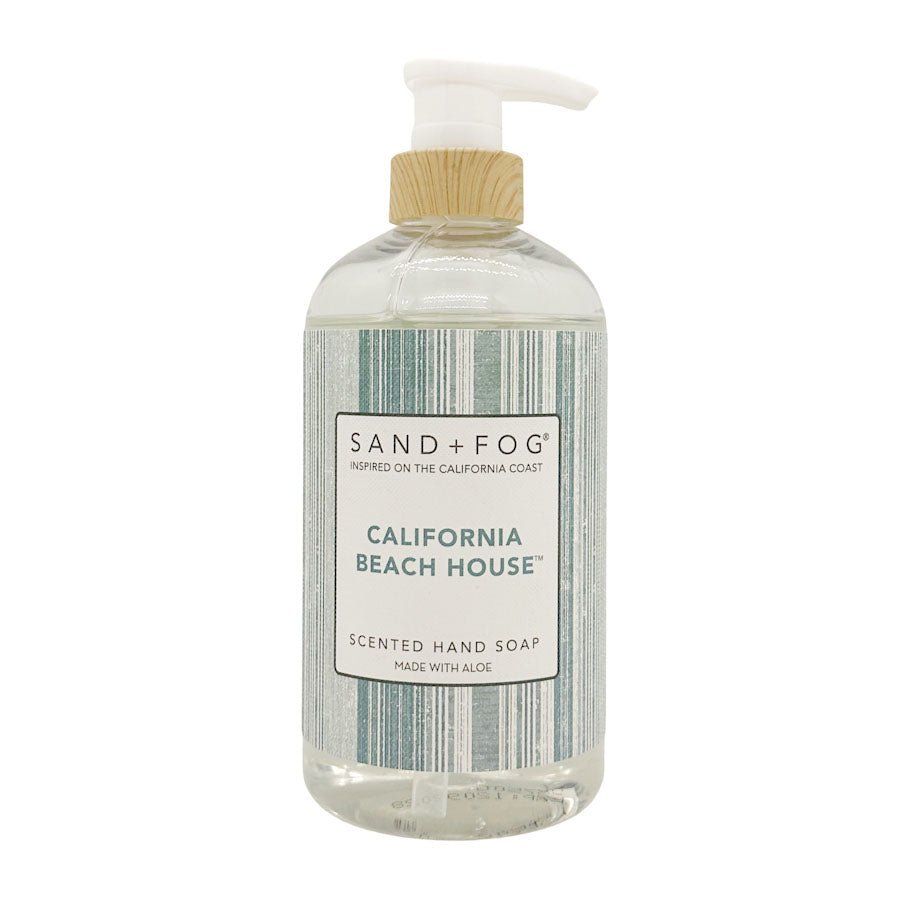 Hand soap bottle with pump labeled 'Sand + Fog California Beach House' on a white background