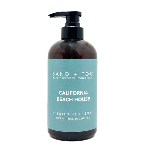 Hand soap bottle labeled 'Sand + Fog California Beach House' on a white background